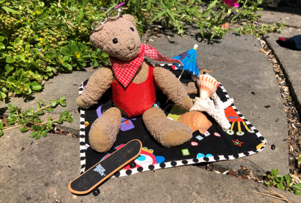 Chuckie is enjoying a picnic in his swimwear.